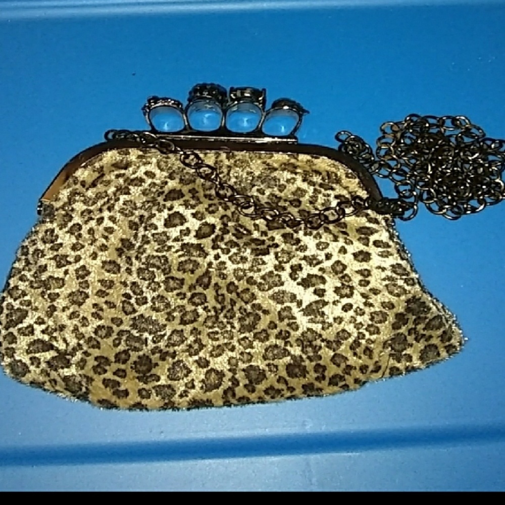 Brass knucle purse